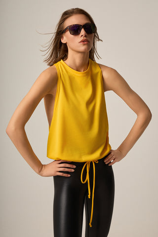 Sleeveless MESH blouse with ruffles at the hem | Amber